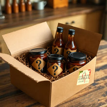 Load image into Gallery viewer, Box of jars and bottles with question marks on labels, placed on a wooden surface.
