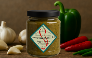 Yummy garlicy preserve in front of garlic, peppers and chillies. If you ask me it looks like it would look good in your basket ;)