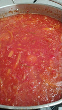 Load image into Gallery viewer, Grapefruit and rosemary preserve in a steel pan being cooked.
