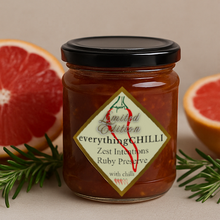 Load image into Gallery viewer, Zest Intentions Ruby Preserve sitting beside a halfed grapefruit and some rosemary. Yum!
